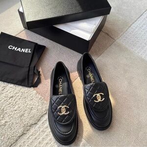 CHANEL Black Quilted Loafers with Gold Logo